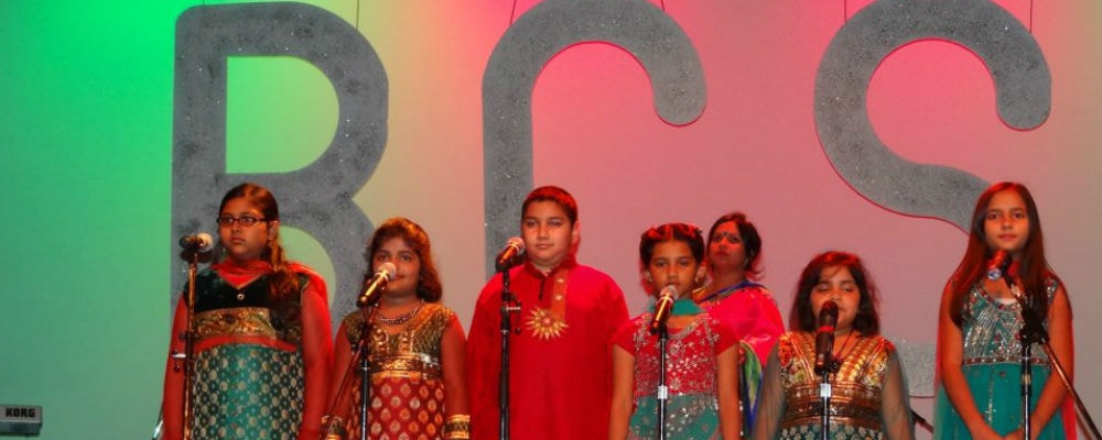 Children performing Bengali music at a cultural celebration